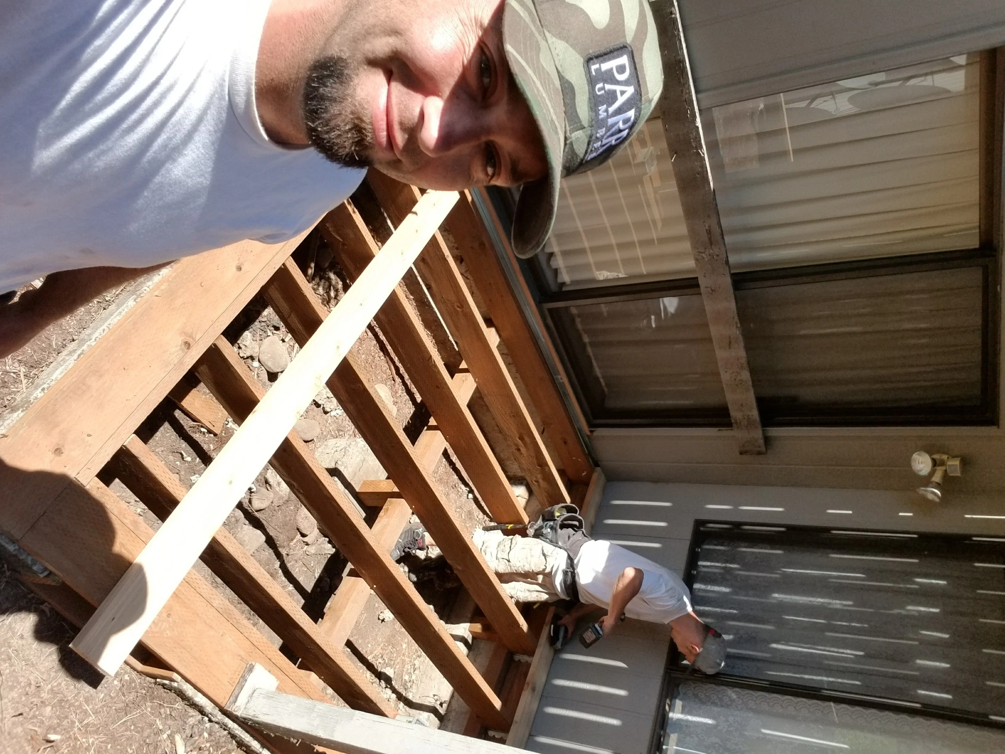 Brick chimney demolition and wood roof framing installation with new lumber bracing