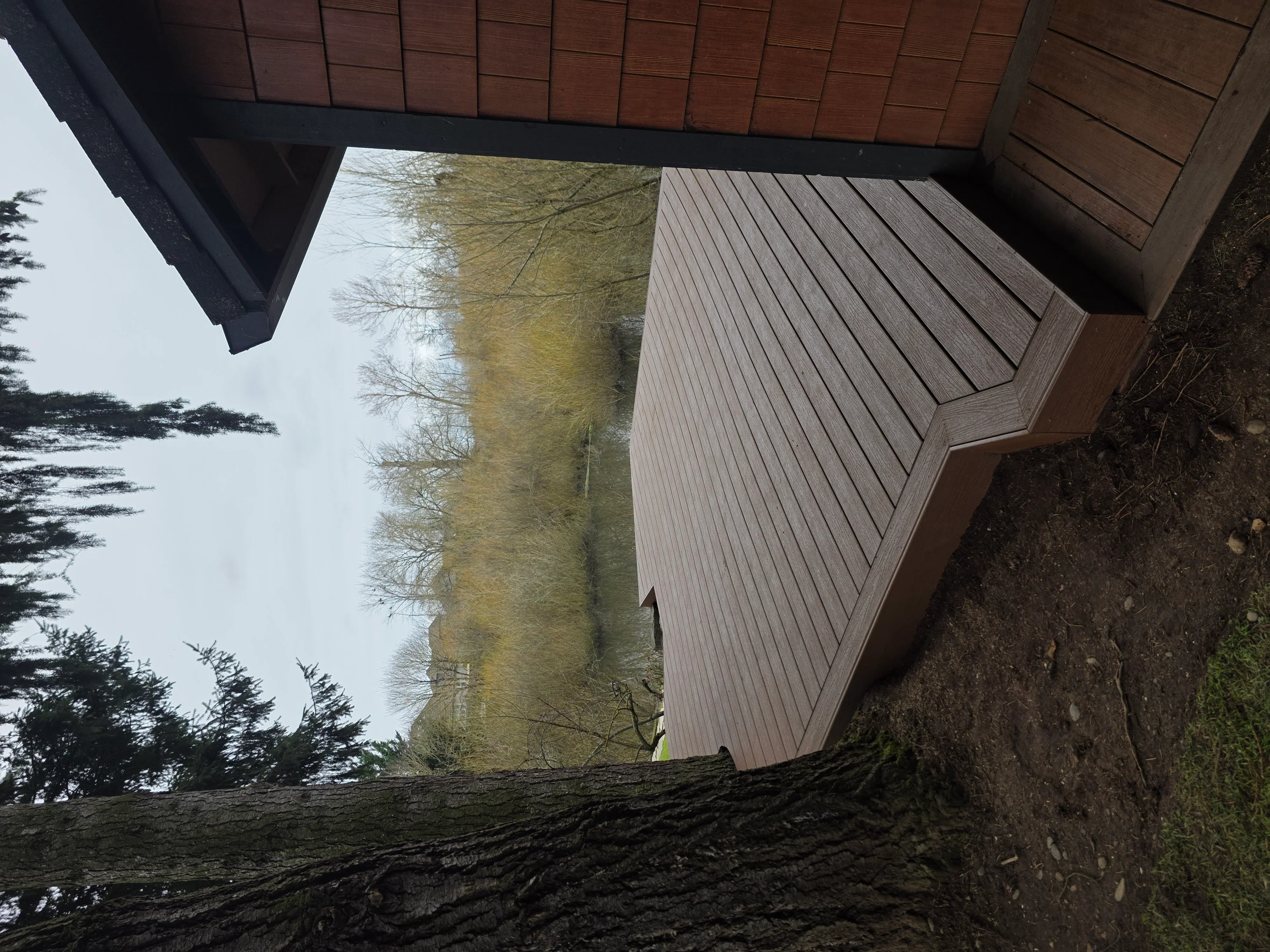 Composite deck with diagonal pattern and covered overhang structure