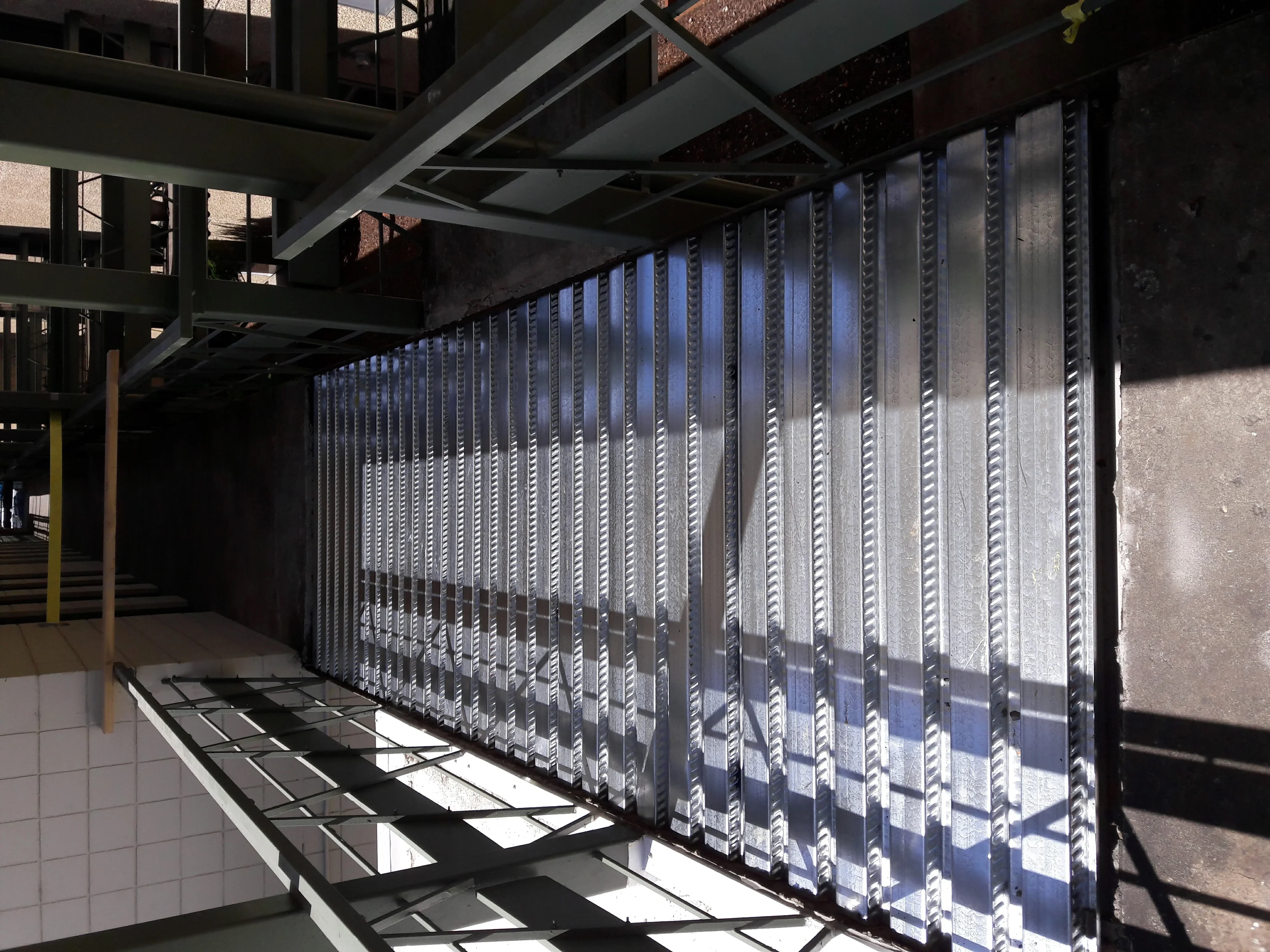 Steel corrugated deck panels installed on industrial steel frame structure
